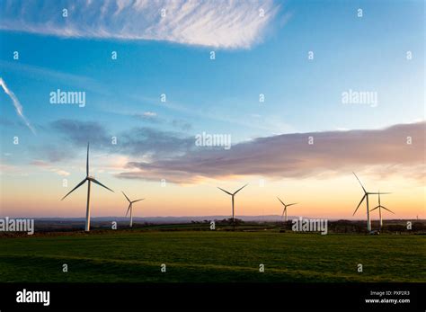 A wind farm at sunrise, South Molton, Devon, UK Stock Photo - Alamy