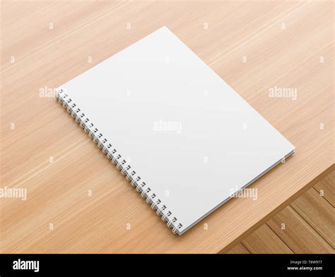 A4 format spiral binding notebook mock up on wooden table. Realistic notebook mock up. 3D ...