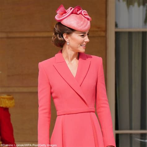 Kate middleton steps out in bright coral for her first buckingham ...