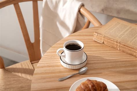 Free Photo | High angle coffee cup and book on table