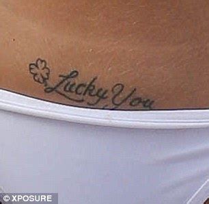 Tulisa FINALLY reveals her hidden tattoo in Marbella... a tacky 'Lucky ...