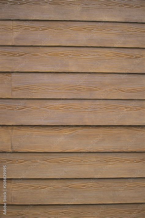 Brown Vinyl Siding Made to Look Like Wood Grain Stock Photo | Adobe Stock