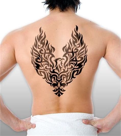 Black tribal phoenix tattoo on back for men - Tattooimages.biz