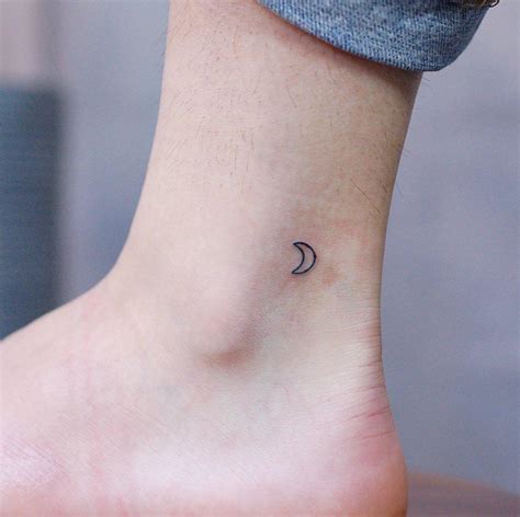 Tiny crescent moon by @wittybutton_tattoo - Tattoogrid.net