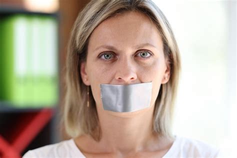 Premium Photo | Woman face with adhesive tape covering mouth