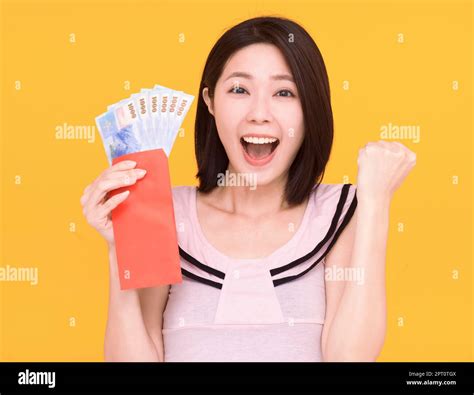 Surprised young woman showing the red envelope and money Stock Photo ...