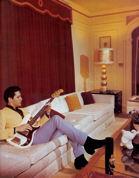 ELVIS PRESLEY at GRACELAND in the living room during its first red ...