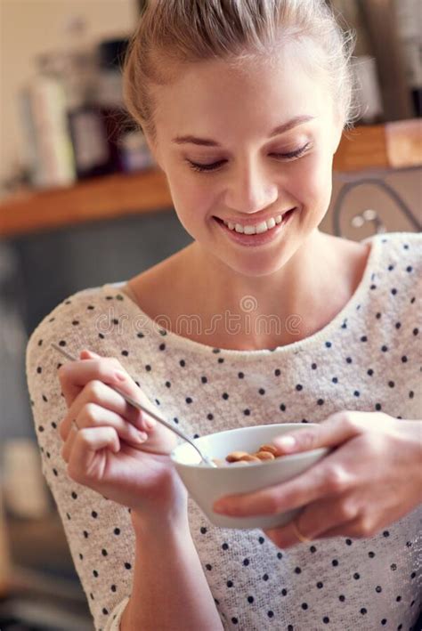 Healthy Snacks- No Guilt, Just Yum. a Young Woman Eating a Healthy Snack at Home. Stock Image ...