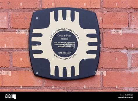 A plaque on a brick wall states the Ortiz y Pino House is a significant ...