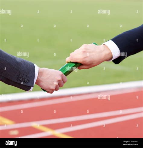 Handover baton in relay race hi-res stock photography and images - Alamy