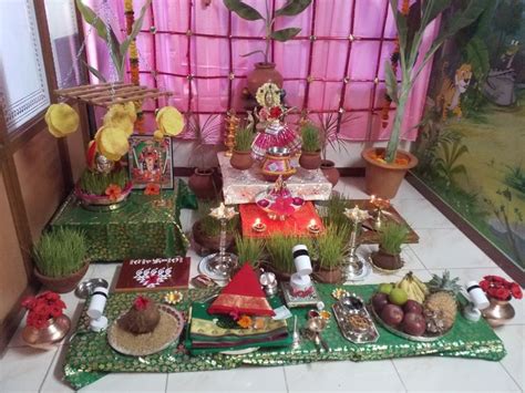 there is a small shrine set up with many items on the table and in front of it