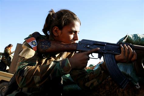 Kurdish women fighters battle Islamic State with machineguns and songs