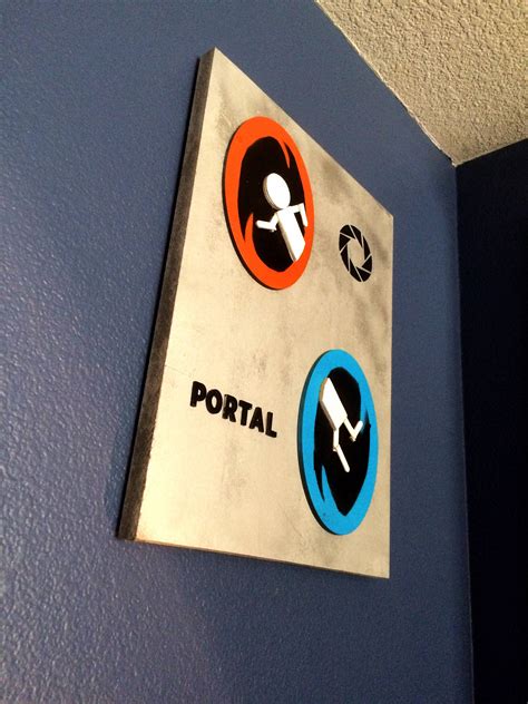 I made a Portal poster for my wall out of some wood and paint ...