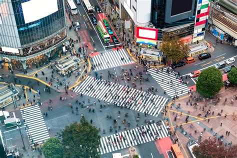 Aerial view of Pedestrians walking across with crowded traffic at ...