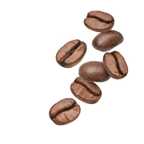 Premium Photo | Falling coffee beans isolated on white background.