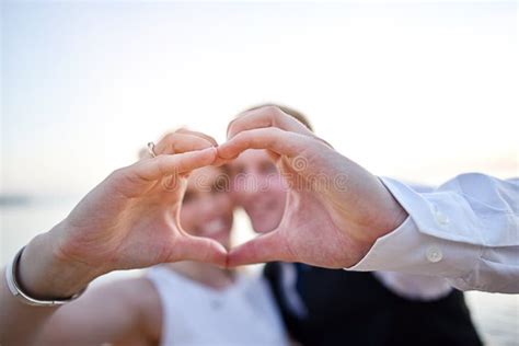 Couple hand making heart stock photo. Image of background - 94509474