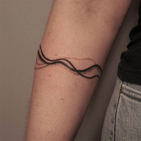 Tattoo uploaded by Christie Zwart • Wavey line composition around the arm #abstract # ...