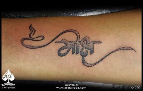 Hindi calligraphy with a Diya at the starting symbol for the Light and Glow dedicated to their ...