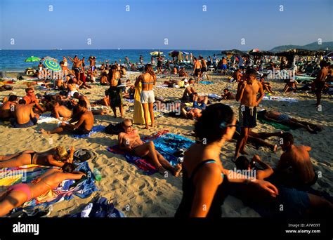 Young people in En Bossa beach Ibiza Balearic islands Spain Stock Photo, Royalty Free Image ...