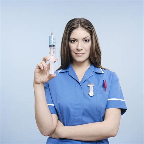 Nurse With Syringe Photograph by Kevin Curtis