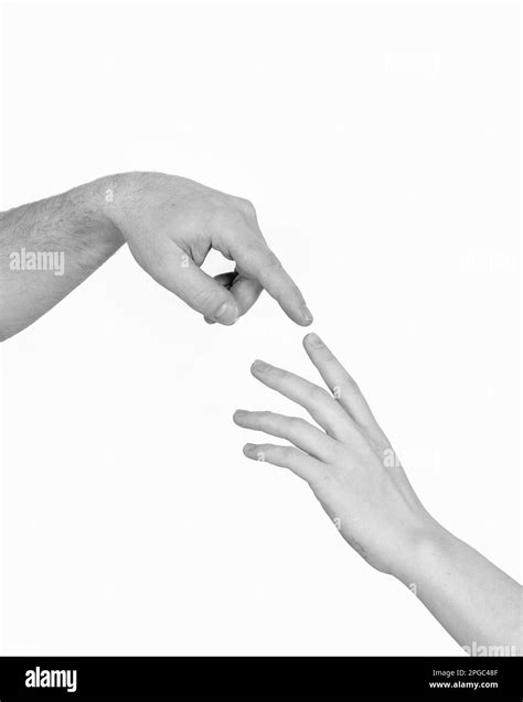Hands reaching other Black and White Stock Photos & Images - Alamy