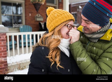 Mature caucasian couple in yellow hi-res stock photography and images