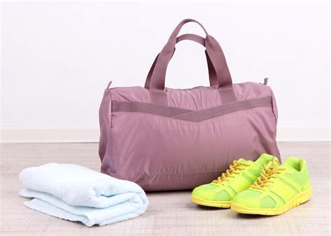 Premium Photo | Sports bag with sports equipment in gymnasium
