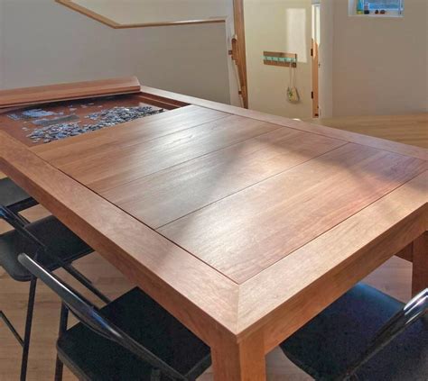 This Amazing Dining Table Has a Hidden Game/Puzzle Compartment Under The Surface