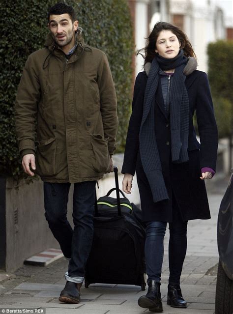 Gemma Arterton cuts a cheerful figure as she steps out with a mystery ...