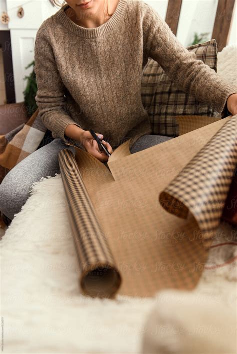 "Wrapping Gifts" by Stocksy Contributor "Milles Team" - Stocksy