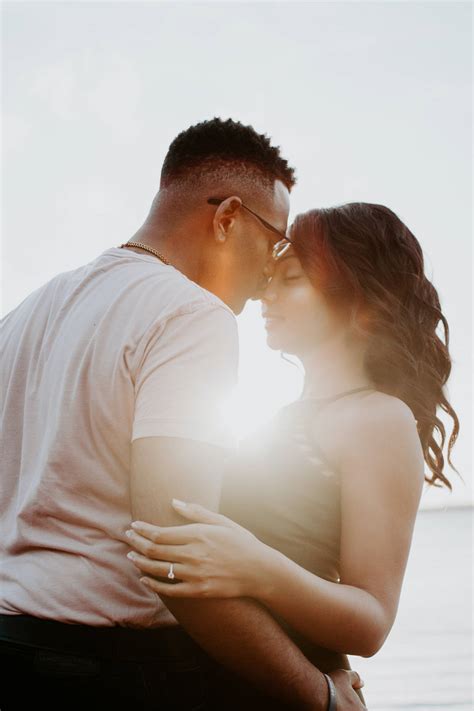 Download Romantic Couple Intimate Sunlight Kiss Wallpaper | Wallpapers.com