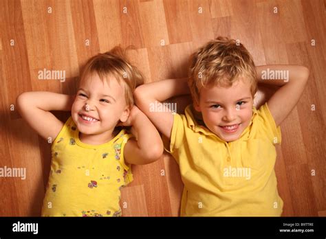 children lie   floor  stock photo alamy