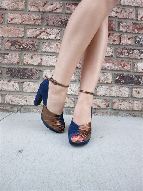 Attention-grabbing suede pair of platform heels w/ metallic accents. By
