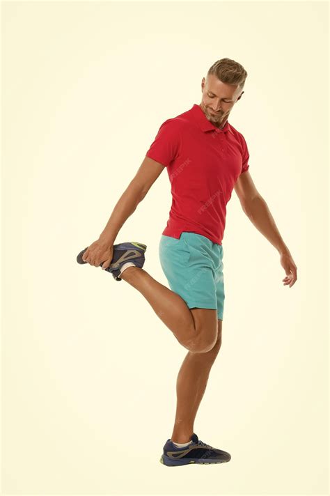 Premium Photo | Warming up with some stretches athletic man stretching