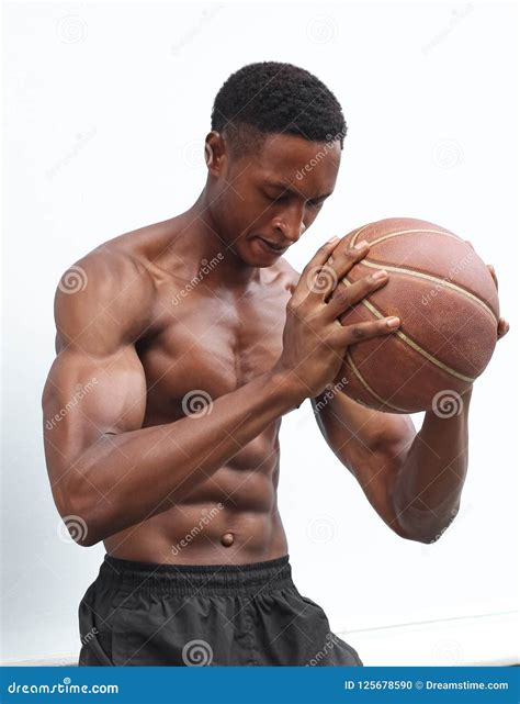 A black muscular male stock photo. Image of black, sitting - 125678590