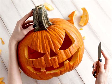 Download Pumpkin Carving With Small Knife Pictures 1500 x 1125 | Wallpapers.com