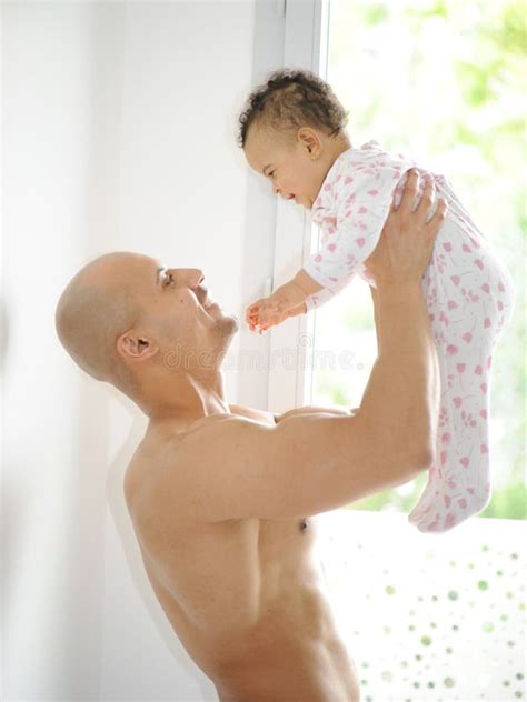 Metis Young Man and His Daughter Stock Photo - Image of game, emotion ...