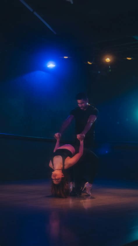 A Performance of a Nude Man and Woman Covered with Grease and Sand