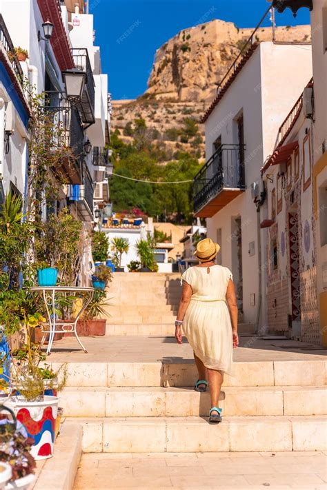 Premium Photo | An older woman tourist visiting the santa cruz