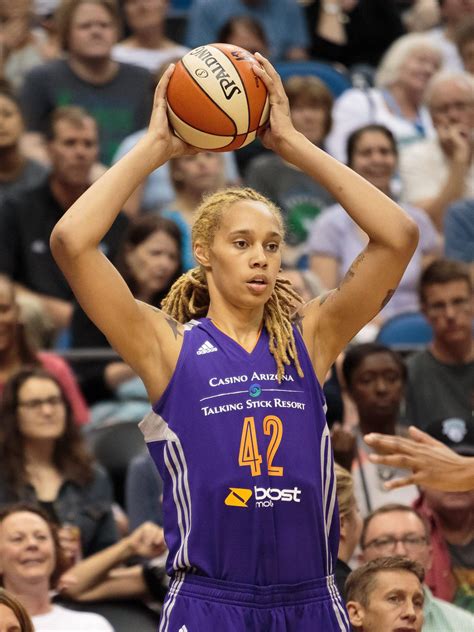 Download Brittney Griner Holding Ball Up Wallpaper | Wallpapers.com