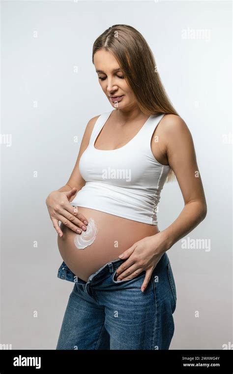 pregnant woman big belly cream  res stock photography  images alamy