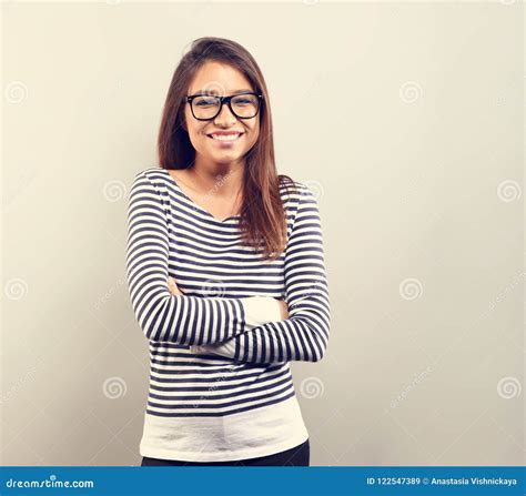 Beautiful Business Latina Woman in Glasses Smiling with Folded a Stock