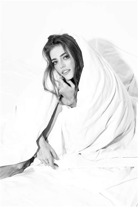 Premium Photo | Sensual woman wrapped in soft blanket sitting on bed