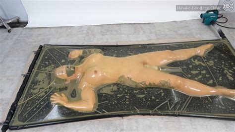 Girl in Transparent Latex Vaccum Bed Gets Teased with Vibrator