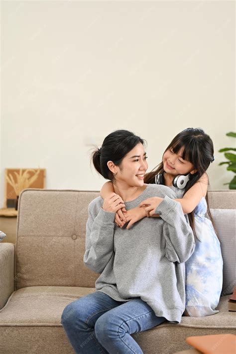 Premium Photo | Lovely Asian mom and daughter playing and spending time