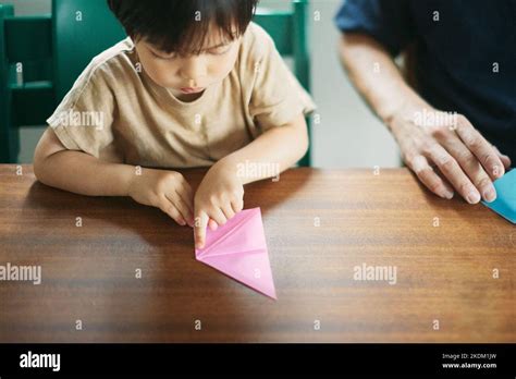 Japanese kid playing with his dad at home Stock Photo - Alamy