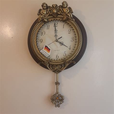 کمدا | قیمت و خرید ساعت دیواری مارک تارا رنگ طرح چوب سایز 37×33