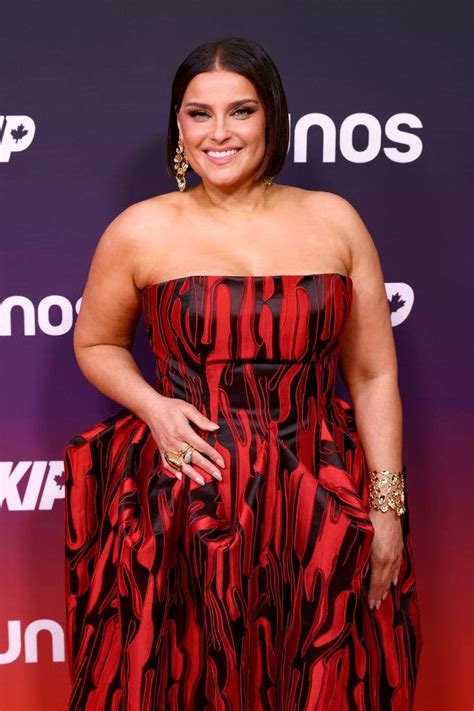 Nelly Furtado turns heads in strapless dress at star studded awards