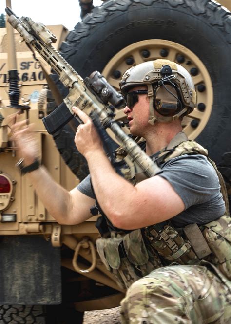 Green Beret with 1st SFG (A) reloads his weapon during high mobility ...