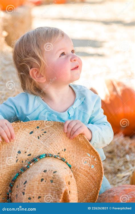 Adorable Baby Girl with Cowboy Hat in a Country Rustic Setting at the ...